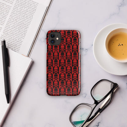 Red skull-pattern phone case with black skull icons and raised edges