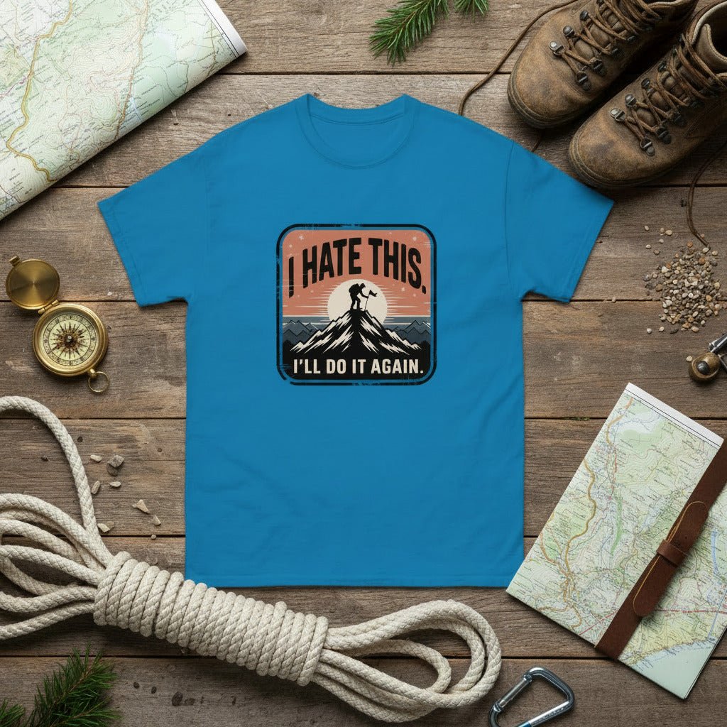 Bright blue hiking T-shirt with “I HATE THIS” mountain graphic on the chest