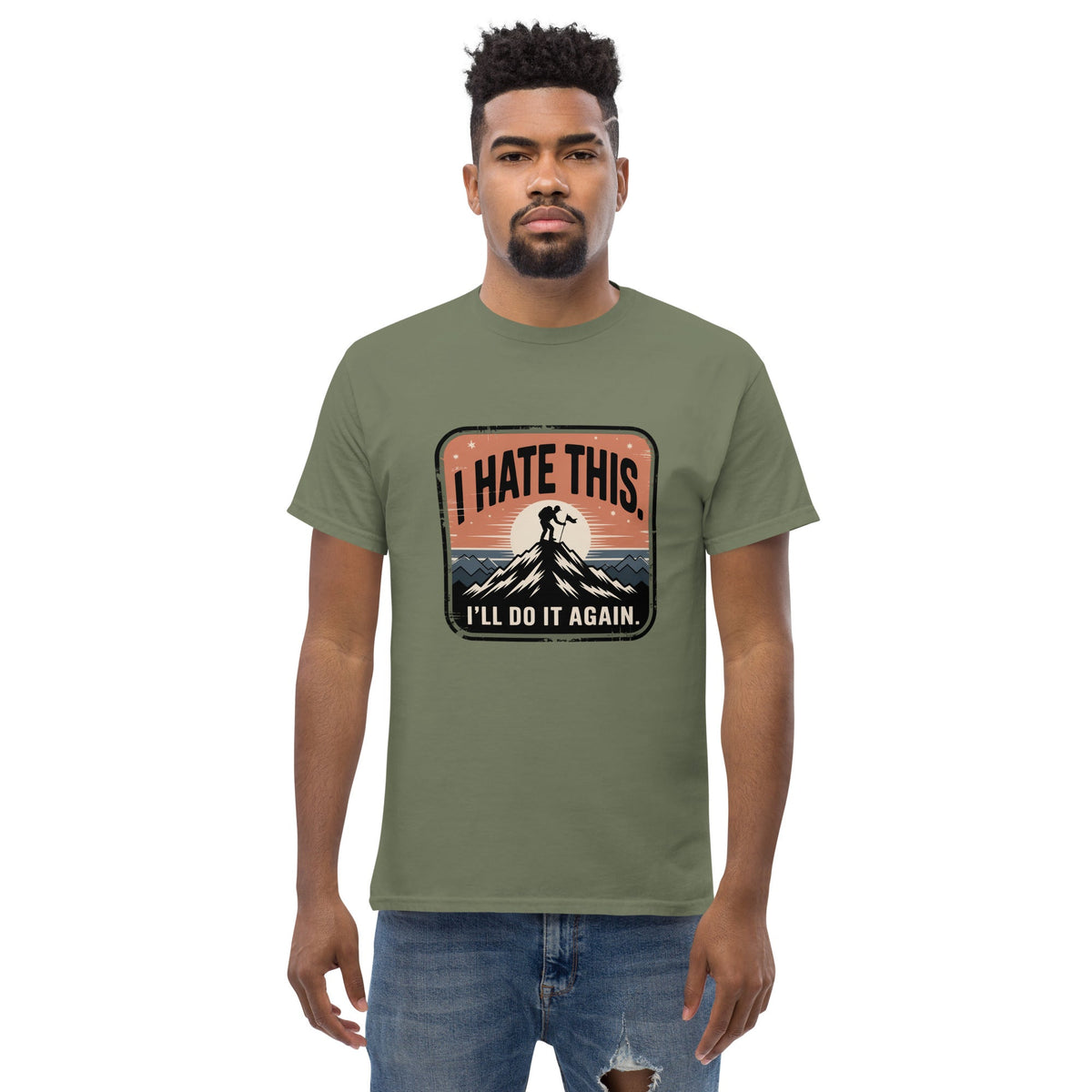 Military green hiking t-shirt with mountain graphic and text 'I HATE THIS'/'I'LL DO IT AGAIN'.