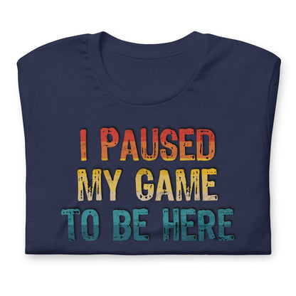 Navy graphic T-shirt: "I PAUSED MY GAME TO BE HERE" with controller icons