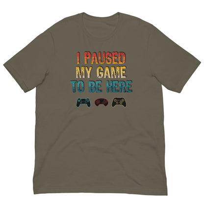 Olive T-shirt with 'I PAUSED MY GAME TO BE HERE' graphic and controller icons