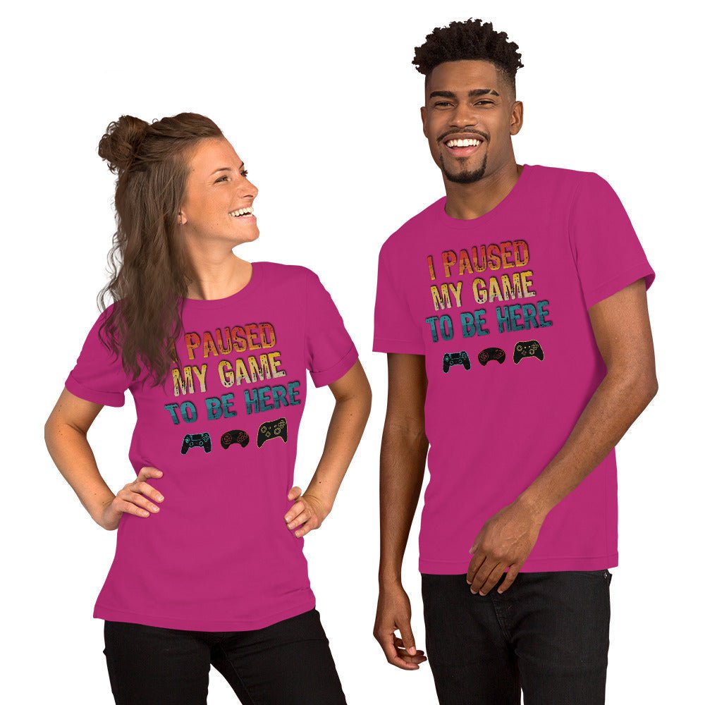 Berry pink graphic T-shirt: "I PAUSED MY GAME TO BE HERE" with controller icons