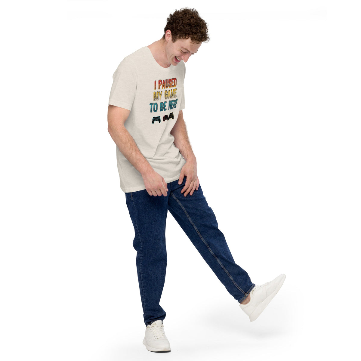 Light T-shirt with 'I PAUSED MY GAME TO BE HERE' graphic and game controller icons
