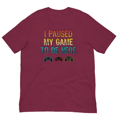 Maroon T-shirt with 'I PAUSED MY GAME TO BE HERE' graphic and controller icons
