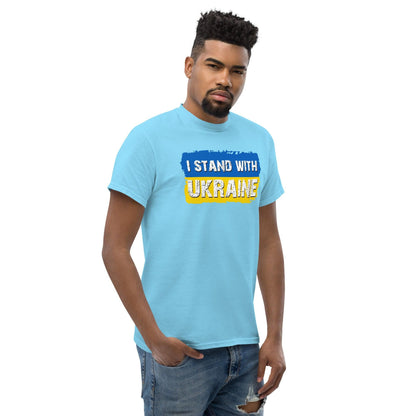 Light blue crewneck T-shirt with “I STAND WITH UKRAINE” graphic in blue and yellow