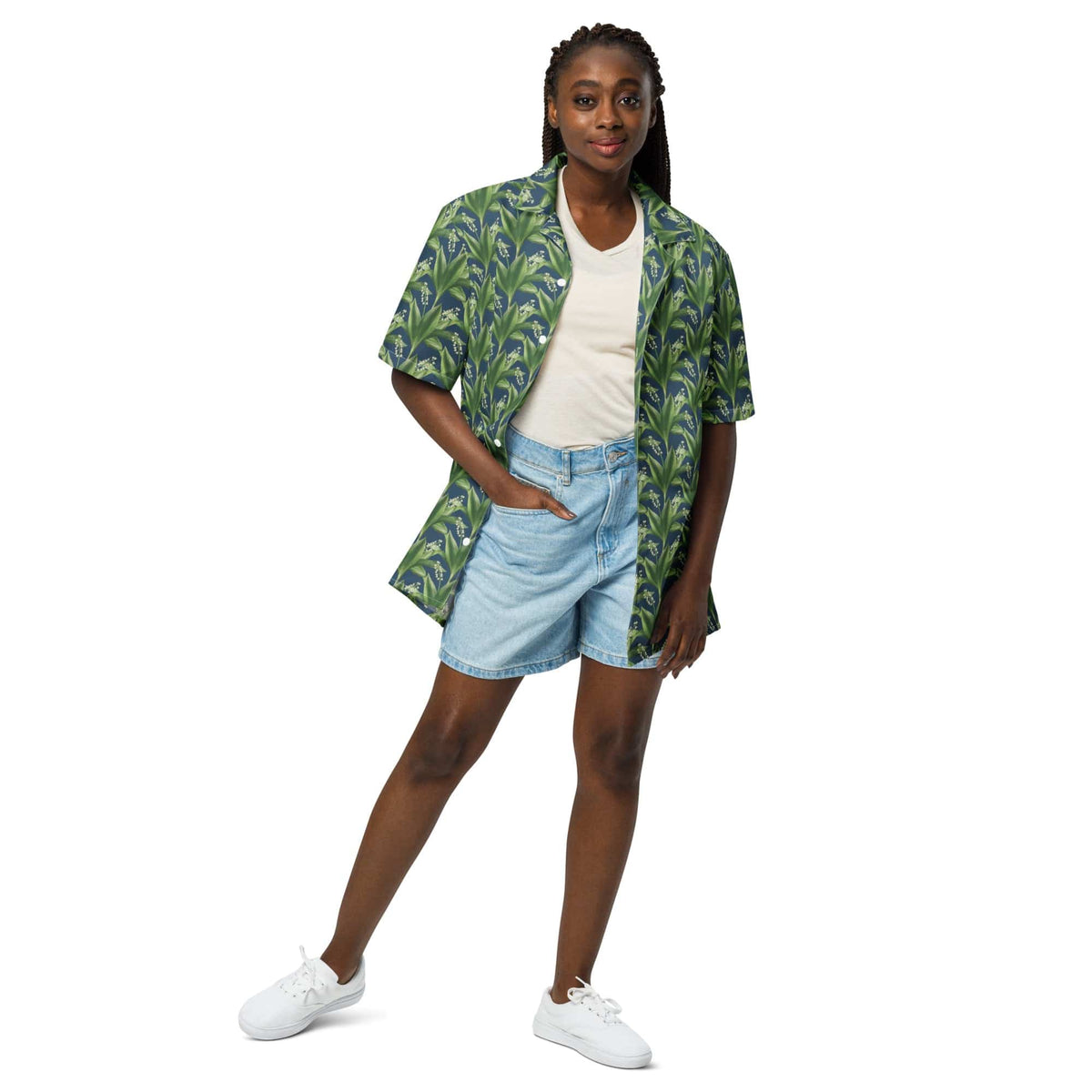 Green leafy print short-sleeve button-up shirt with open camp collar.
