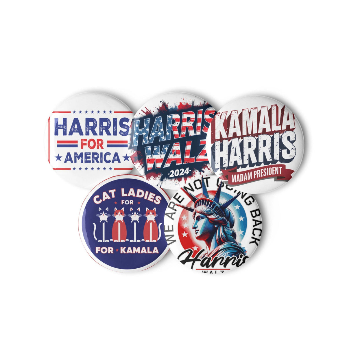 Close-up cluster of five round pin buttons with Harris and Kamala campaign designs