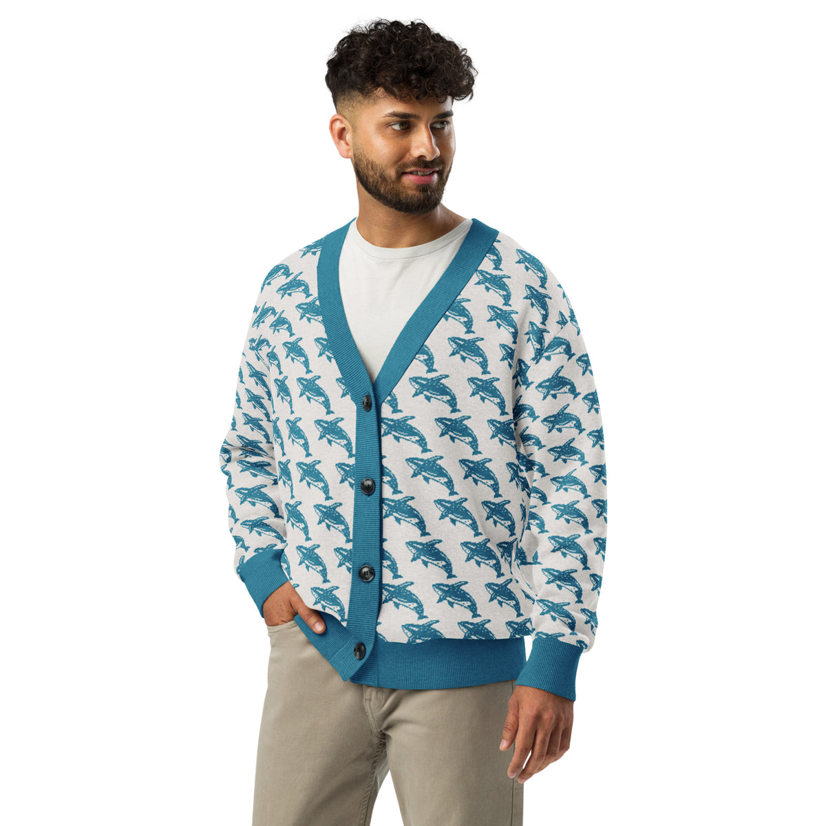 Knitted cardigan with whale pattern, blue V-neck border, dark buttons, ribbed waistband