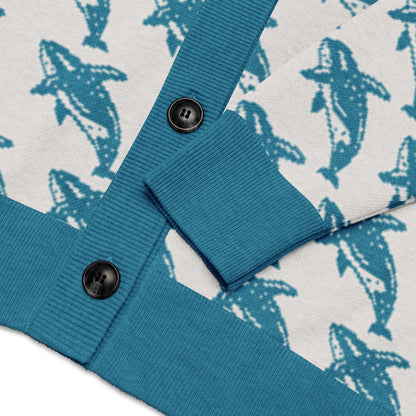 Blue ribbed cuff with dark button detail on knitted cardigan with whale print