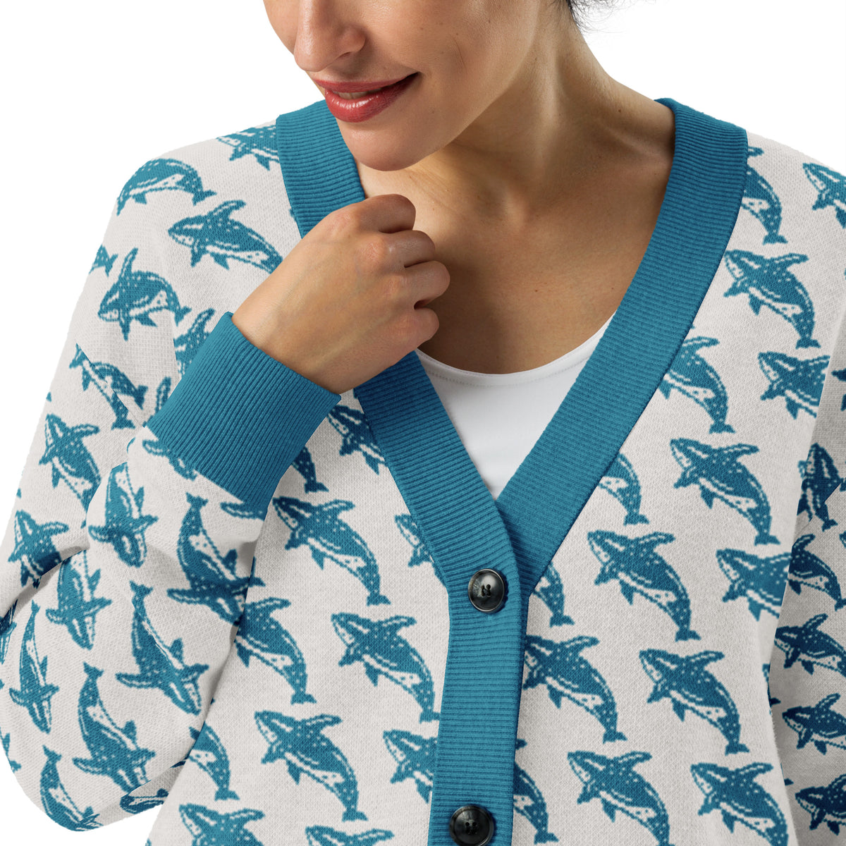 Knitted cardigan with blue V-neck rib trim, whale print, and black button placket