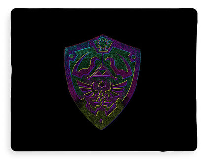 Dark blanket with small centered purple and green shield emblem graphic.