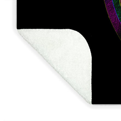 Blanket corner with white plush underside and black top border, rounded edge.