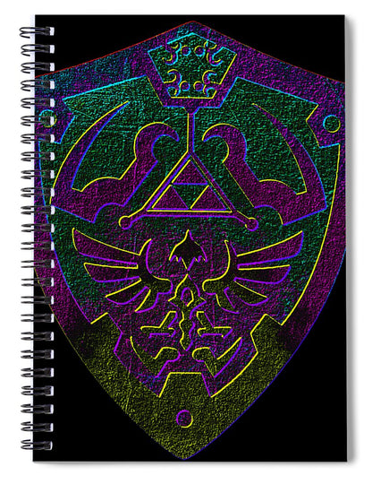 Spiral notebook with holographic-style gaming shield emblem cover and metal ring binding