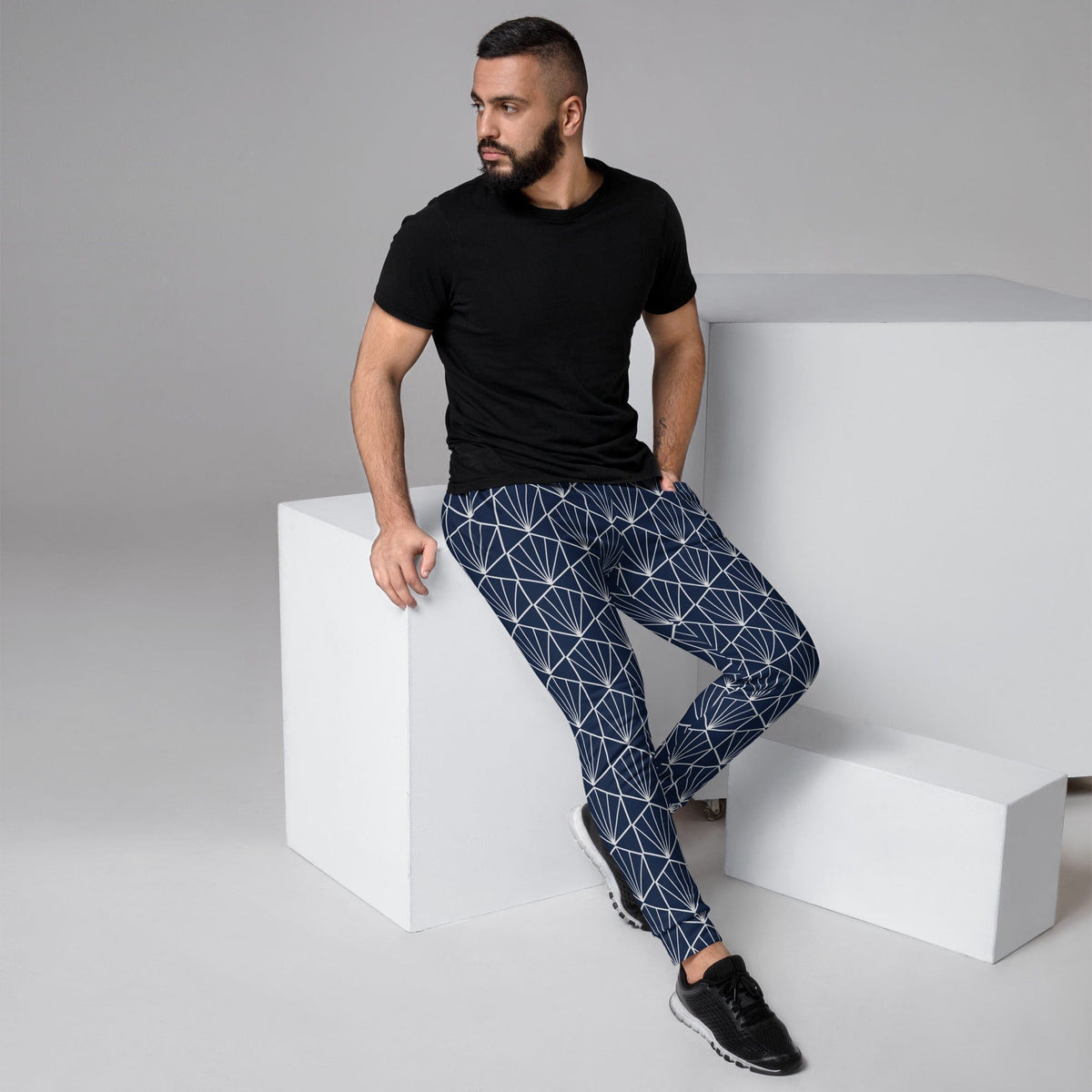 Men's joggers in navy with white geometric pattern, tapered fit and elastic waistband