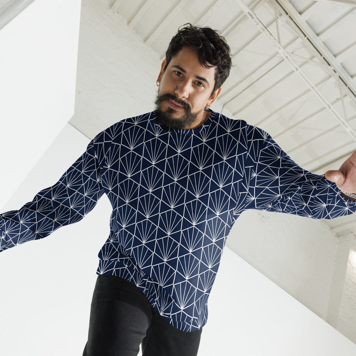Navy sweatshirt with white geometric fan lines, long sleeves and relaxed fit