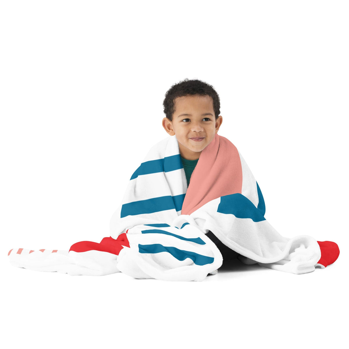 White throw blanket with blue stripes, teal accents, and red and pink shapes draped on body.
