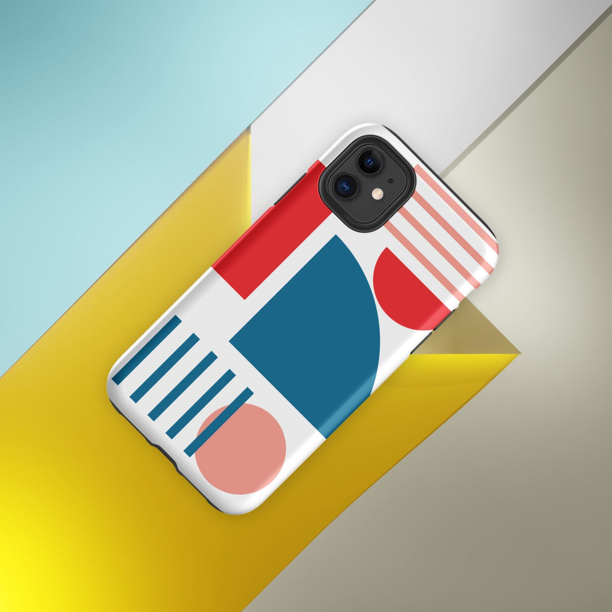 Angled tough iPhone case with red, blue, and coral abstract blocks and stripe pattern