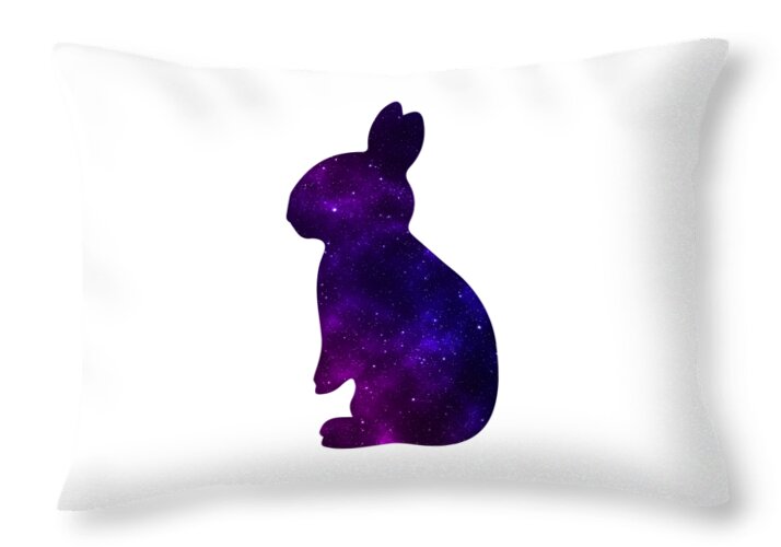 White throw pillow with purple galaxy rabbit silhouette, slightly angled view