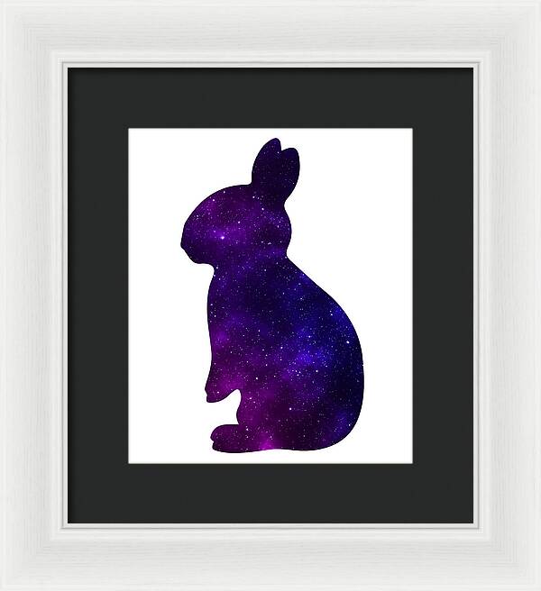 Framed print of purple galaxy rabbit silhouette with dark frame and white mat