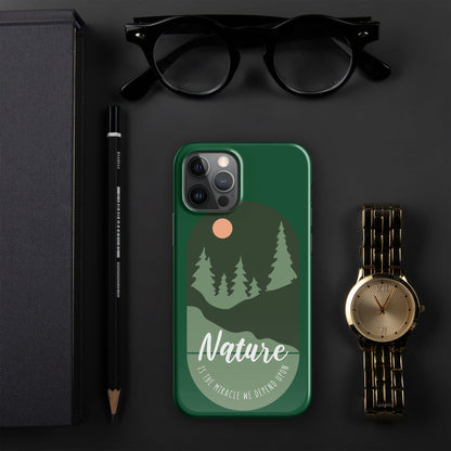 Green iPhone snap case with nature scene design, forest silhouettes, and camera cutouts