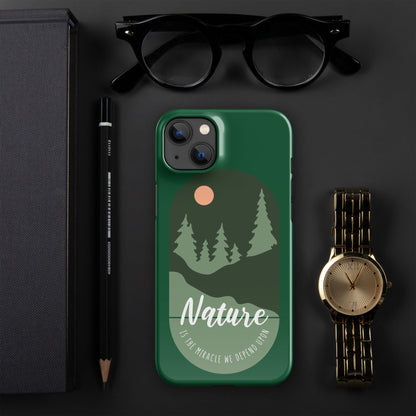 Green iPhone snap case with nature forest scene and moon dot, camera cutout.