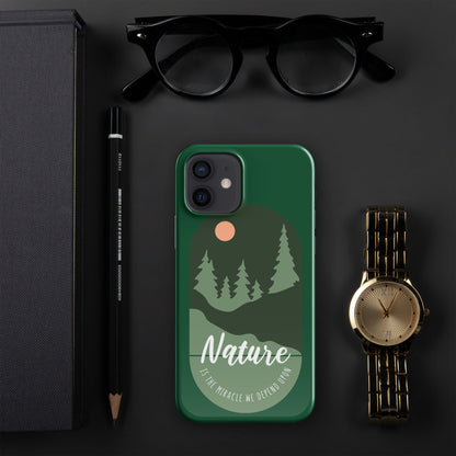 Green iPhone snap case featuring nature trees, sun circle graphic, and camera cutout openings