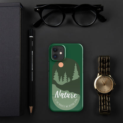 Green iPhone snap case with nature landscape print, tree silhouettes, and raised camera area