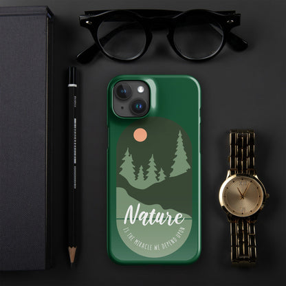 Green iPhone snap case showing tree silhouettes, moon detail, and camera cutouts.