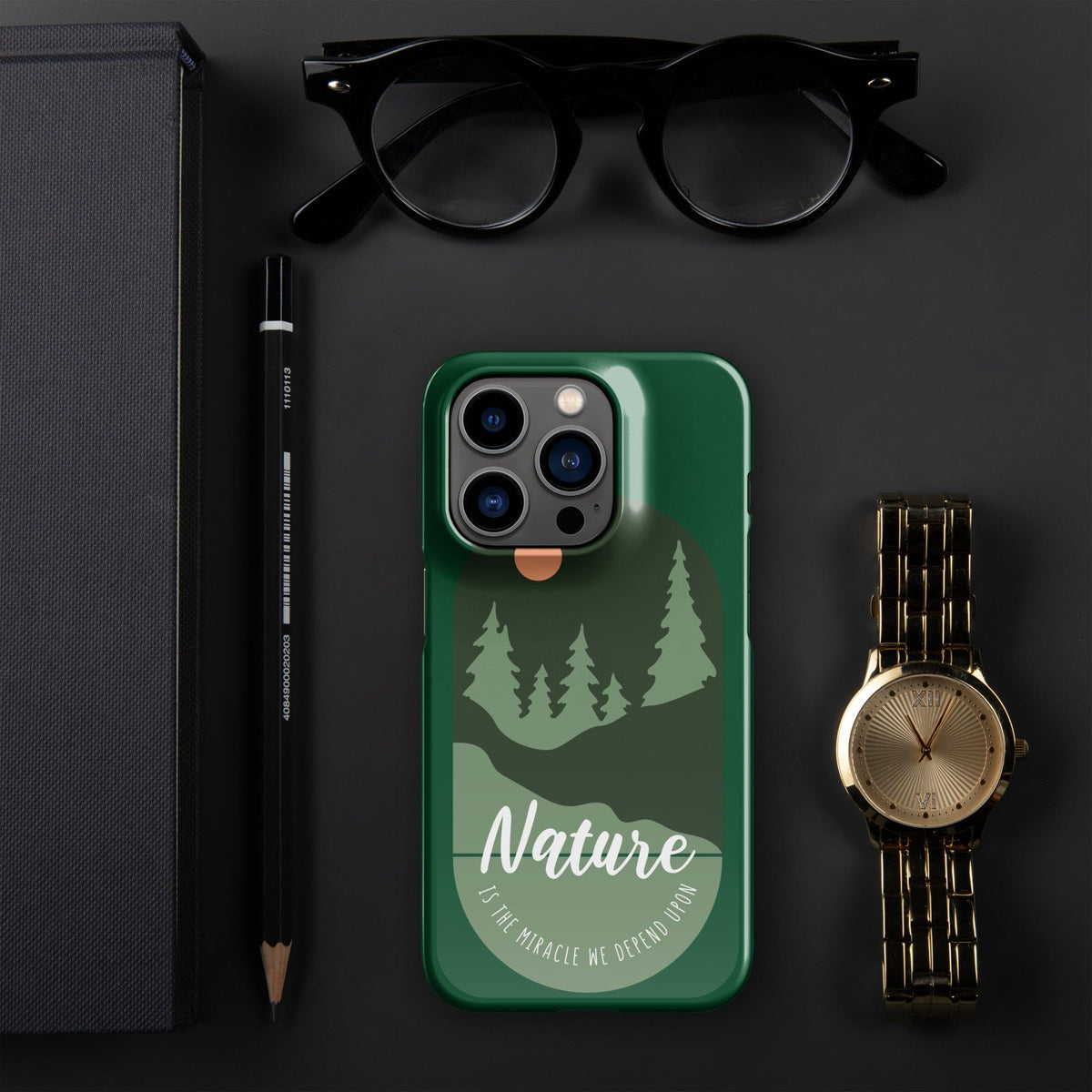 Green iPhone snap case featuring tree silhouettes, moon graphic, and camera cutouts.