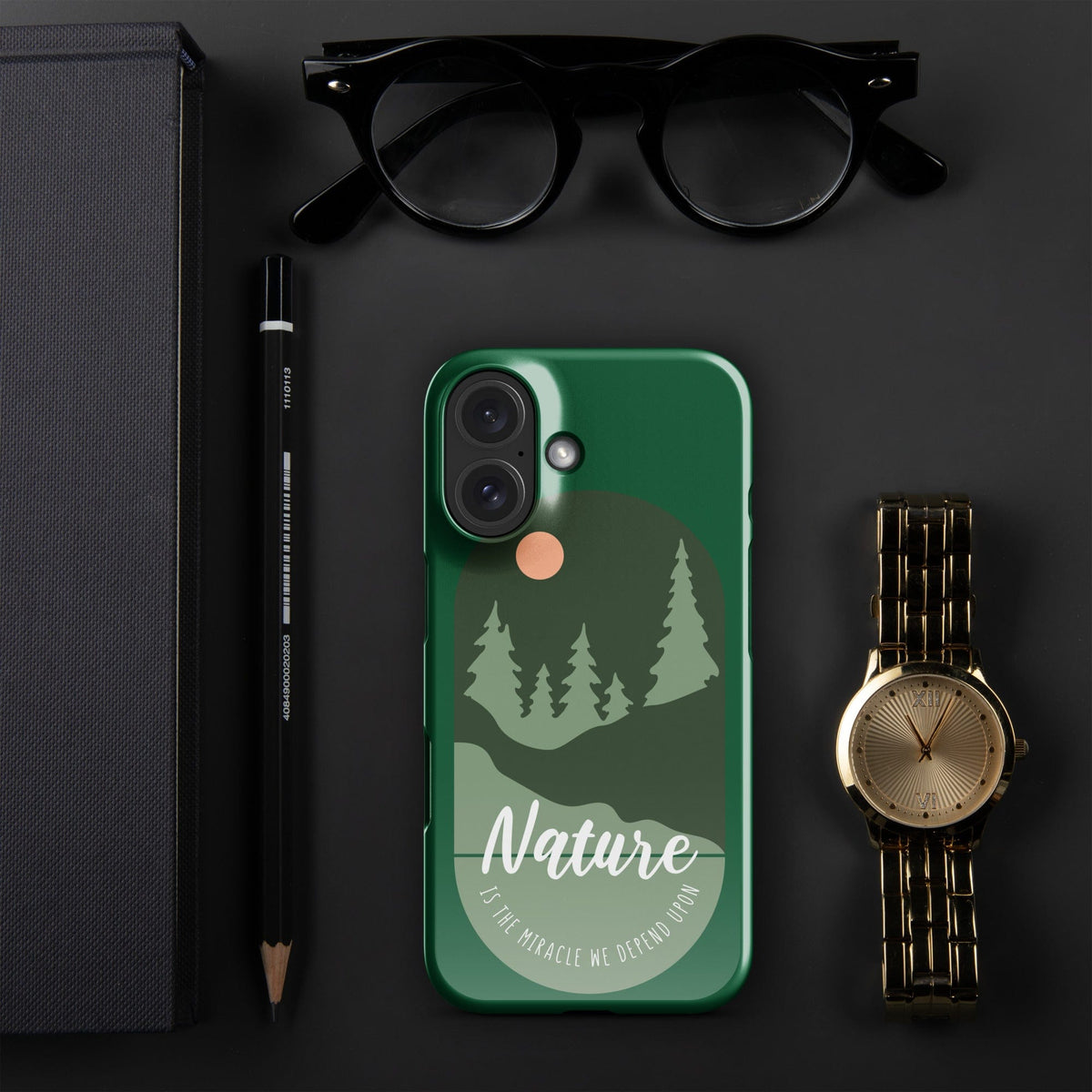 Green iPhone snap case with tree silhouettes, moon graphic, and camera cutouts.
