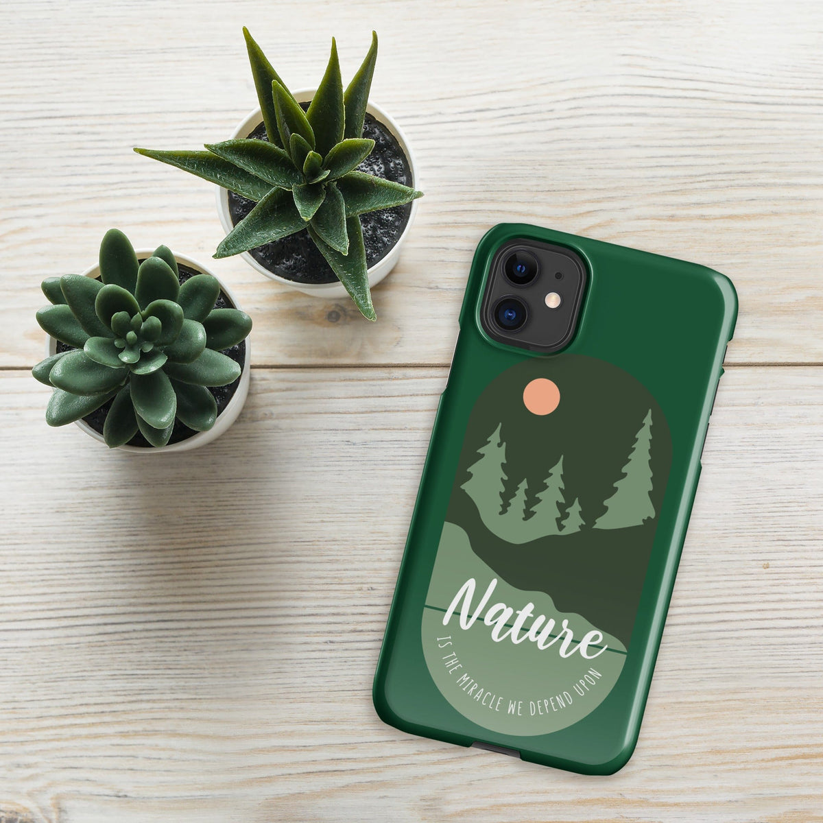 Green iPhone snap case with Nature forest graphic and raised camera cutouts