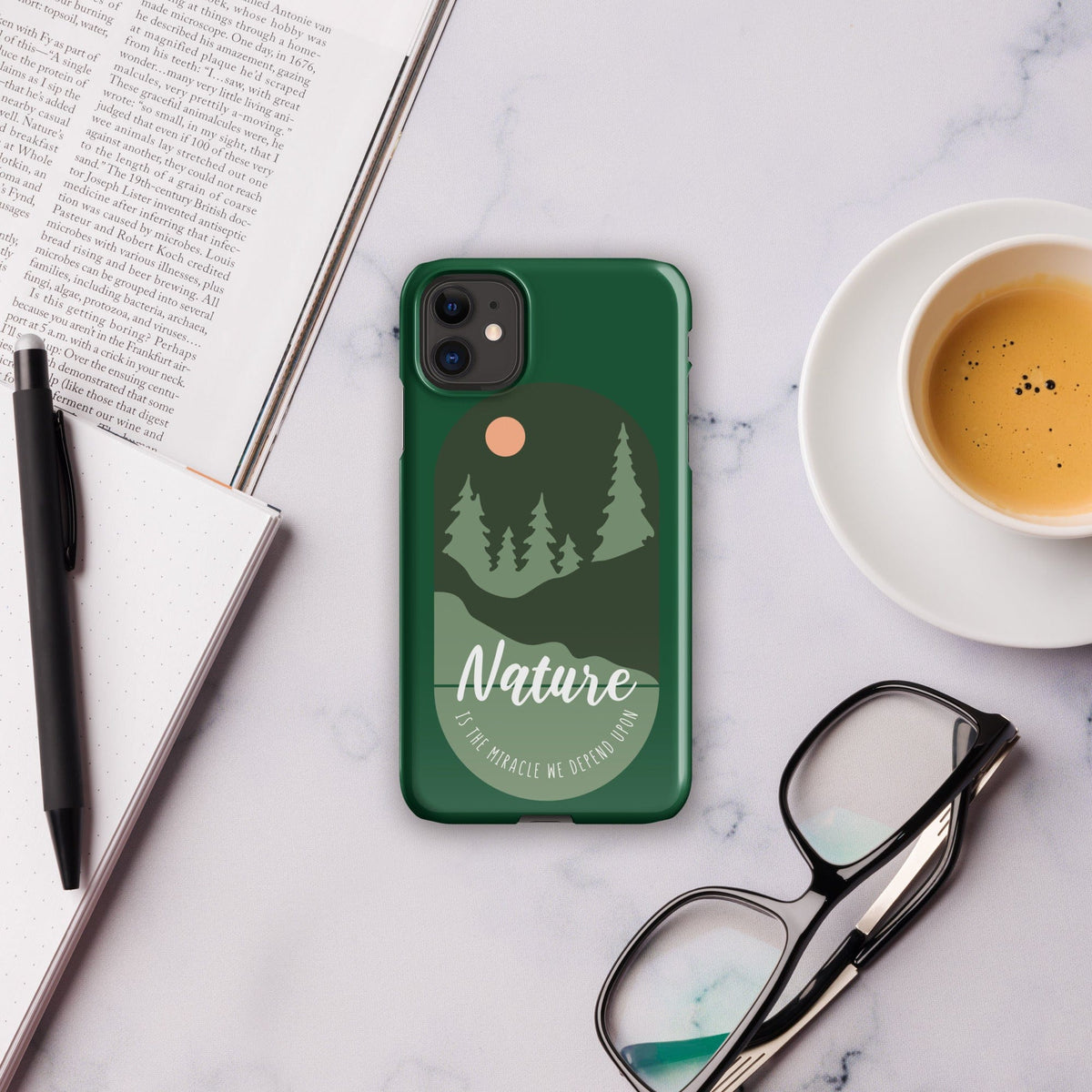 Green iPhone snap case showing Nature forest graphic with two-lens camera cutout