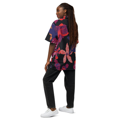 Unisex short-sleeve button-up shirt with dark floral print, side view on model