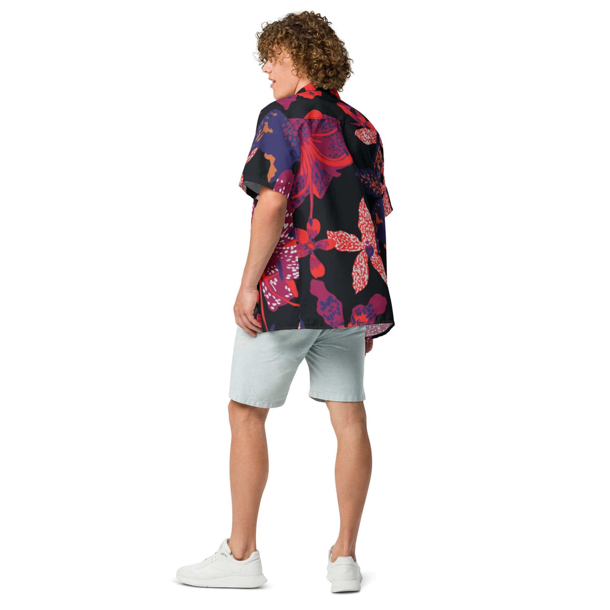 Unisex short-sleeve button-up shirt with dark floral print, back view on model
