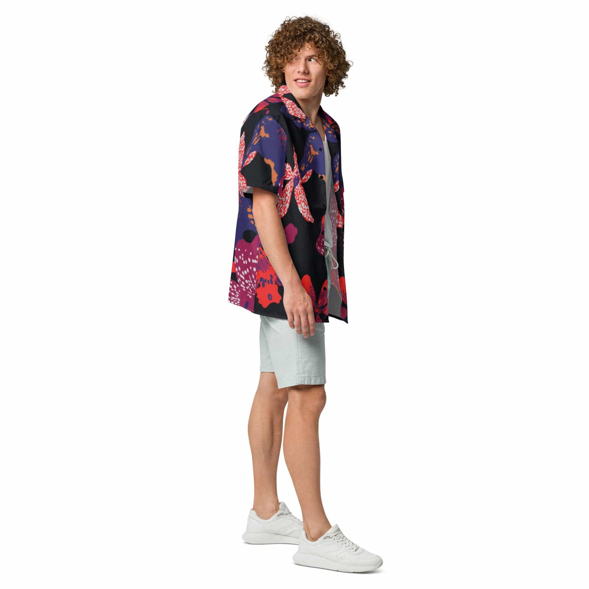 Unisex short-sleeve button-up shirt with multicolor flower print, worn by model