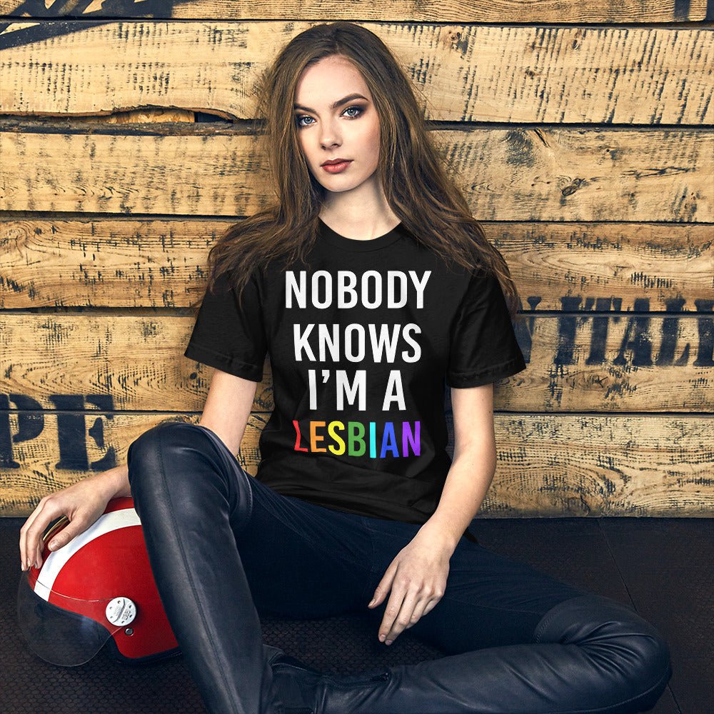 Black T-shirt with white “NOBODY KNOWS I’M A” and red “LESBIAN” text graphic