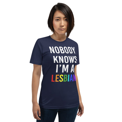 Navy T-shirt with white stacked text and red “LESBIAN” on the chest