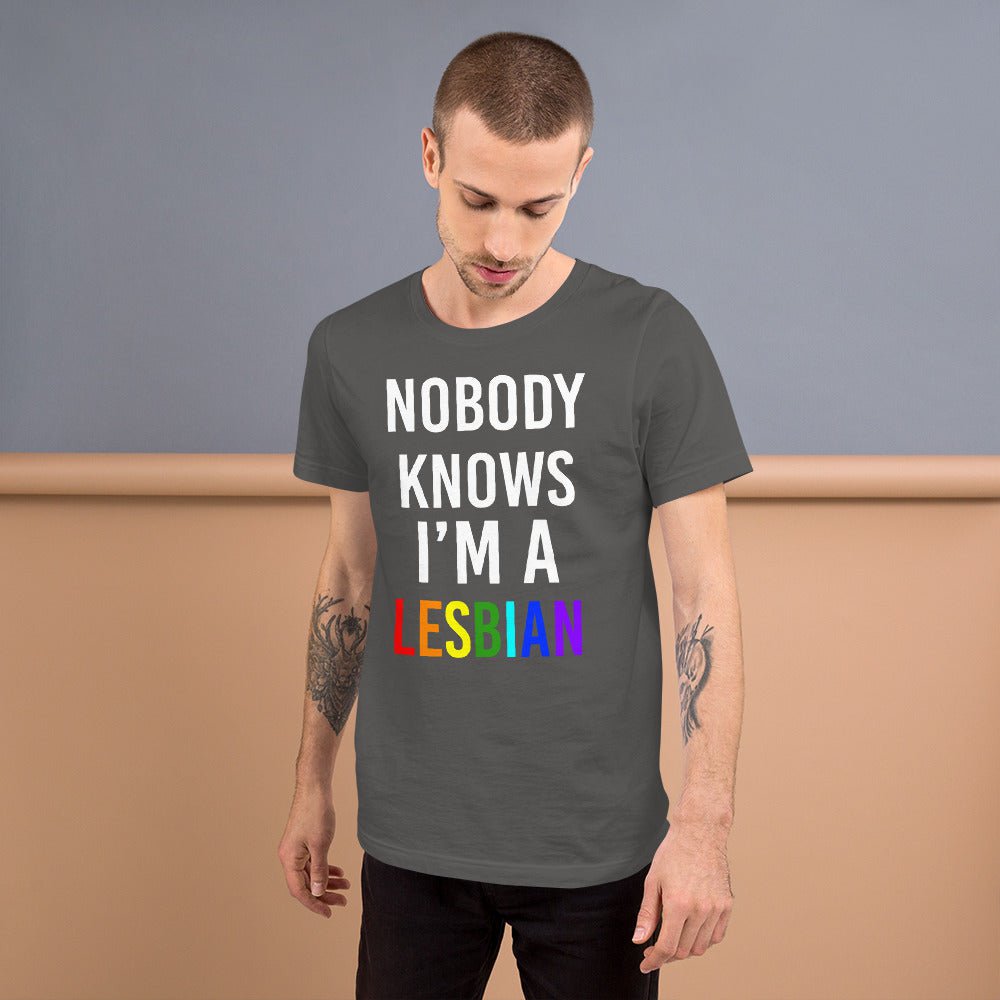 Asphalt gray T-shirt with white “NOBODY KNOWS I’M A” and red “LESBIAN” text
