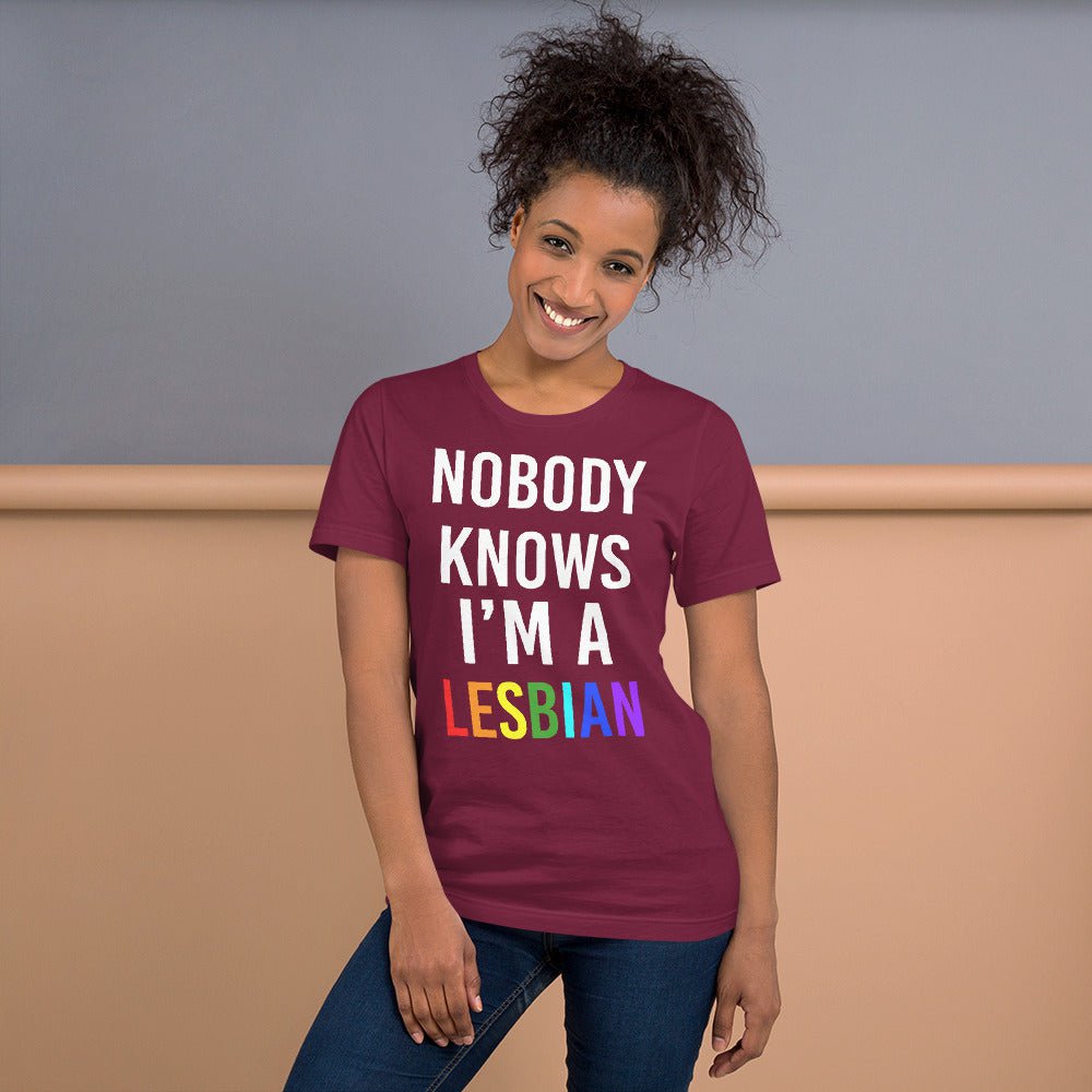 Berry T-shirt with stacked white text and red “LESBIAN” graphic on chest