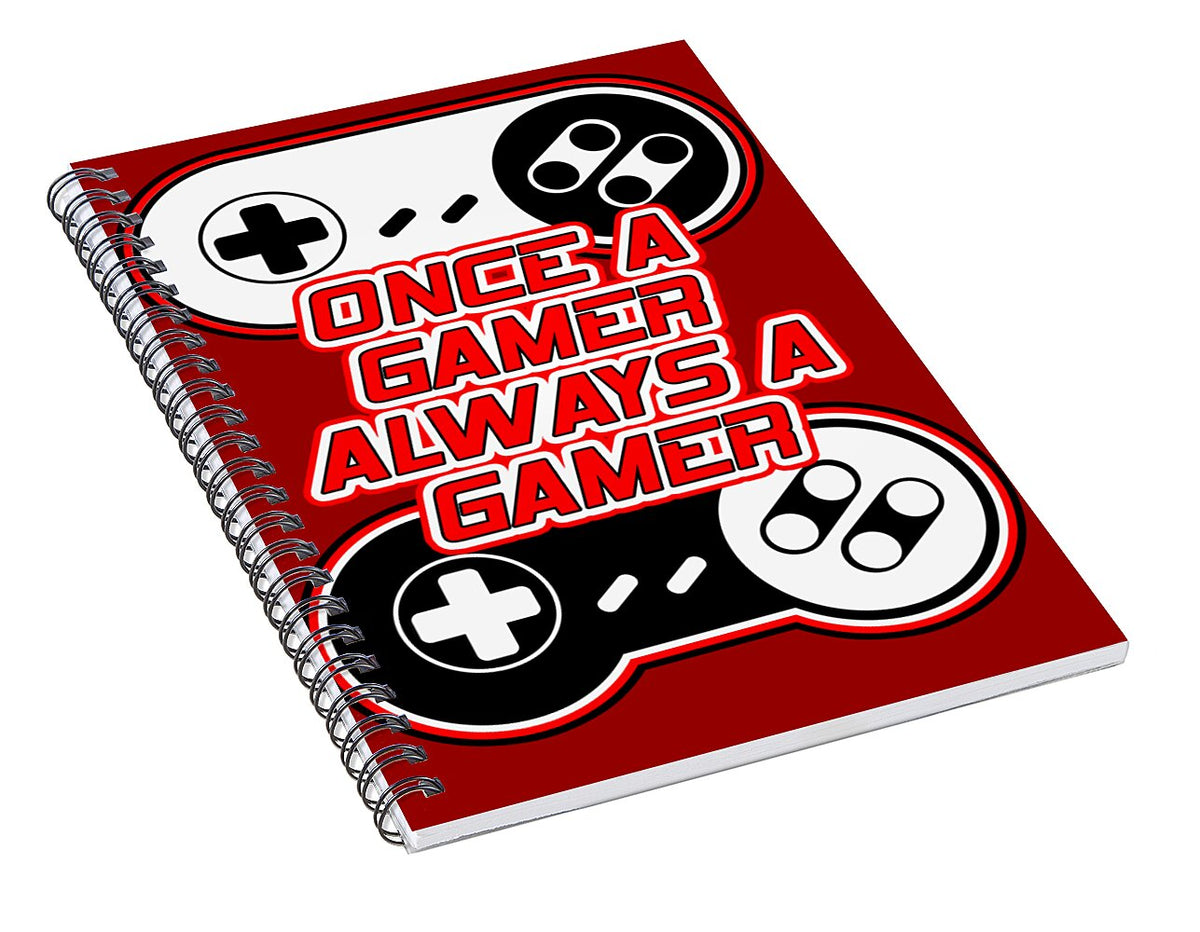 Red spiral notebook angled view with game controller icons and gamer slogan