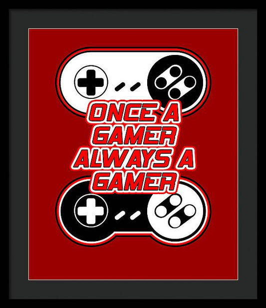 Black framed gaming quote print with red background, controller icons, and text 'ONCE A GAMER ALWAYS A GAMER'.