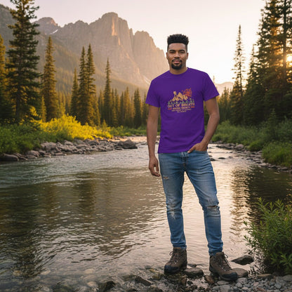 Purple hiking graphic T-shirt with cabin and compass emblem, worn by a man