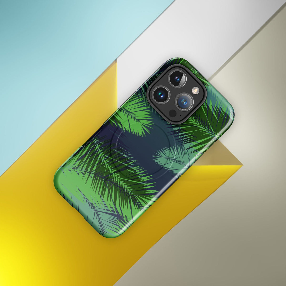 Tropical palm print phone case in green over dark navy, MagSafe-compatible
