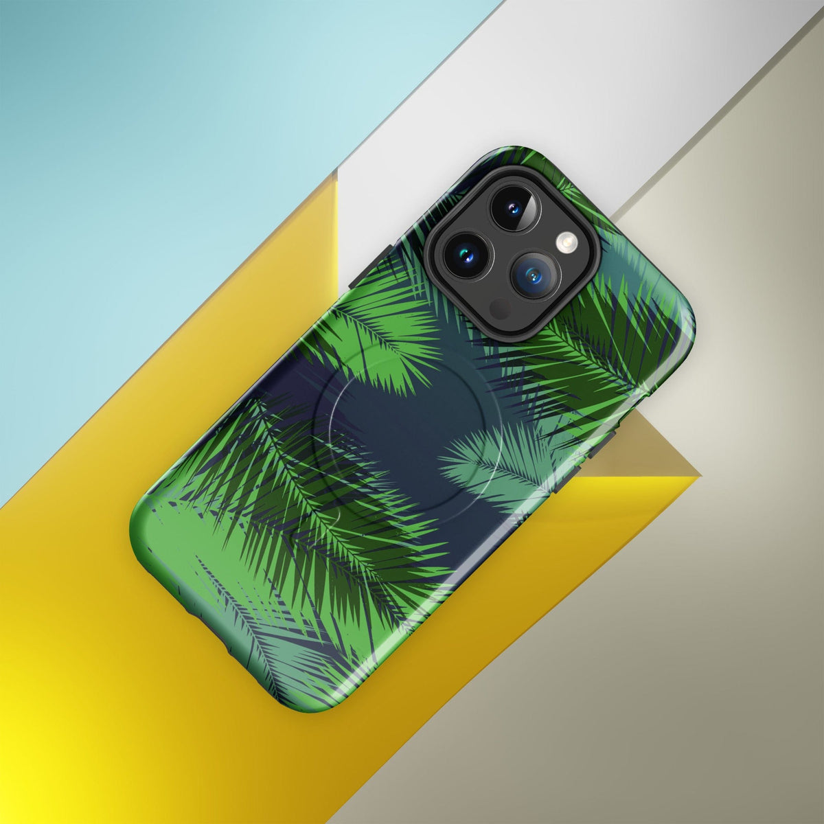 Tropical phone case with green palm leaves print and raised camera housing