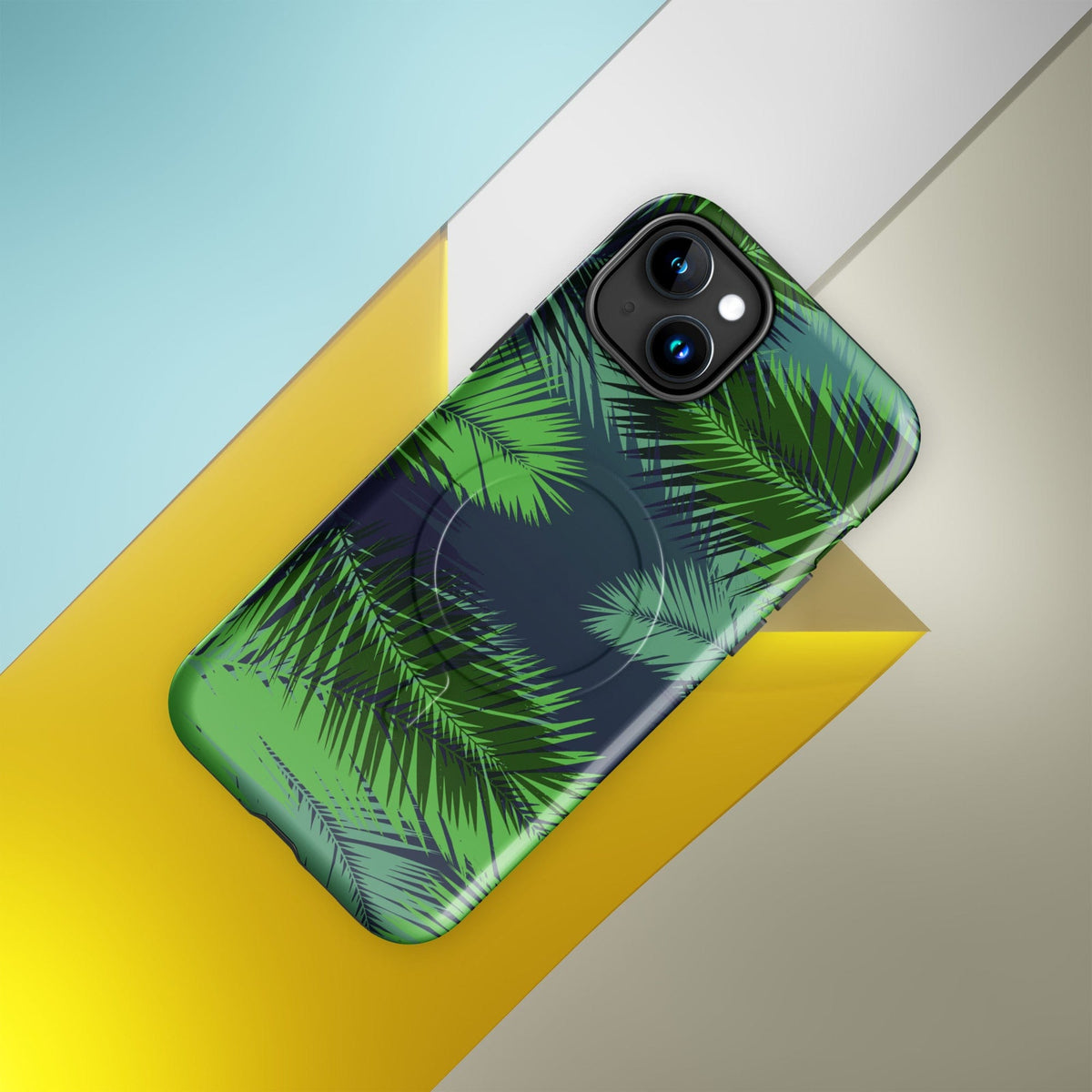 Tropical MagSafe phone case with green palm leaves print and dual-camera lens openings
