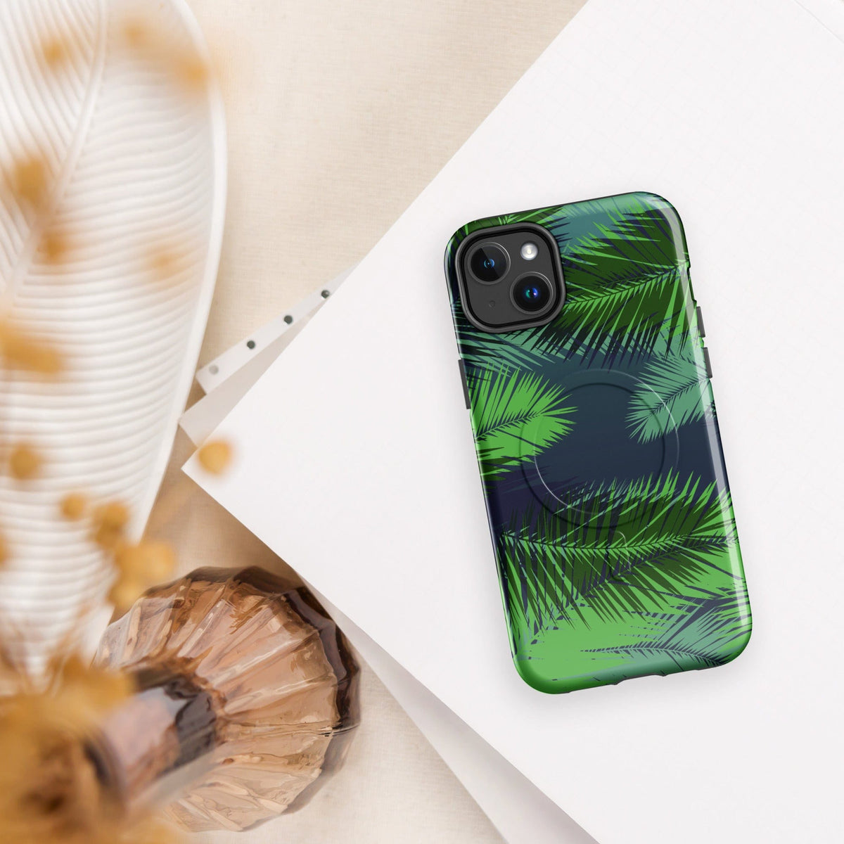 Tropical phone case with green palm leaves pattern and raised dual-camera housing