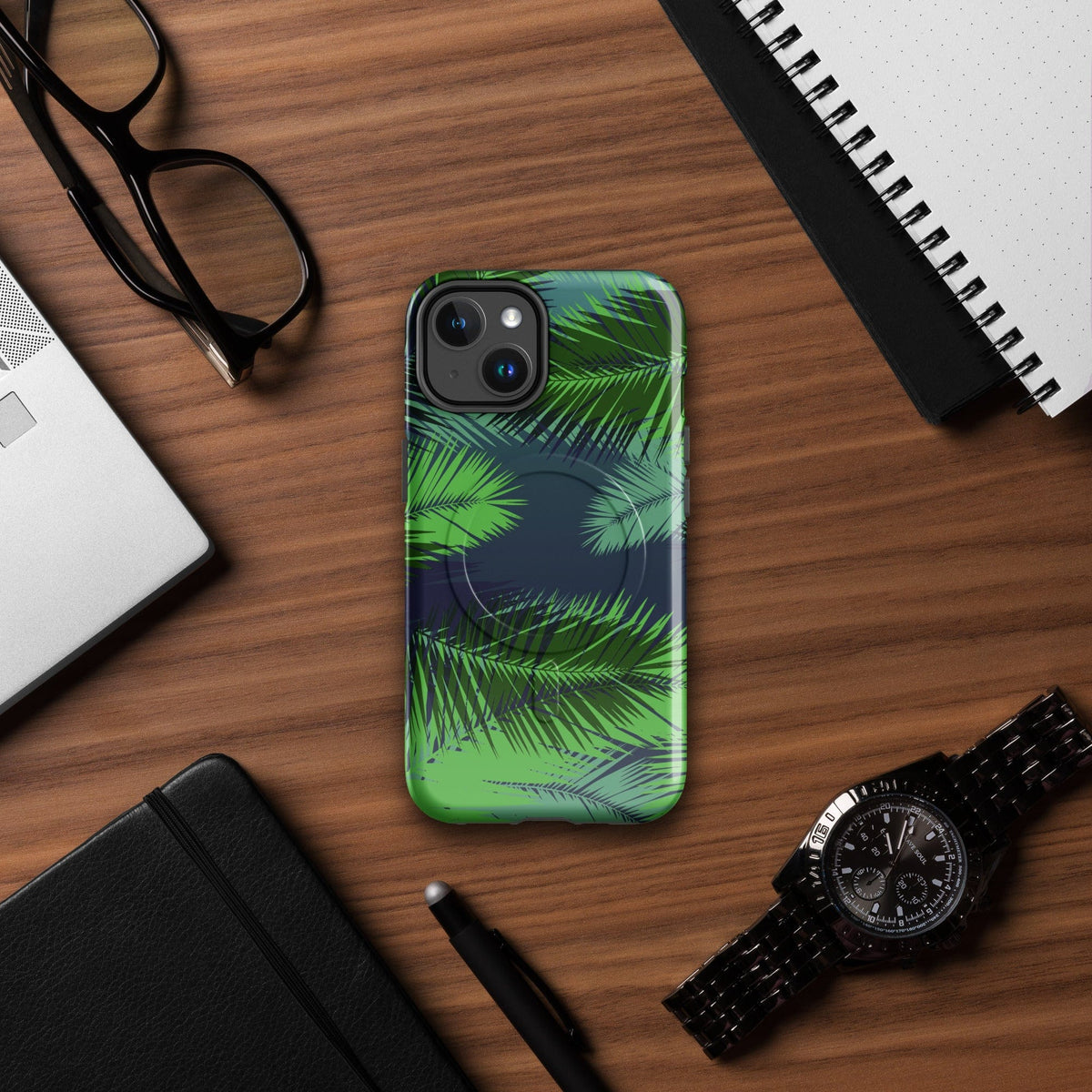 Tropical phone case with green palm leaf print, MagSafe styling, and rugged edge