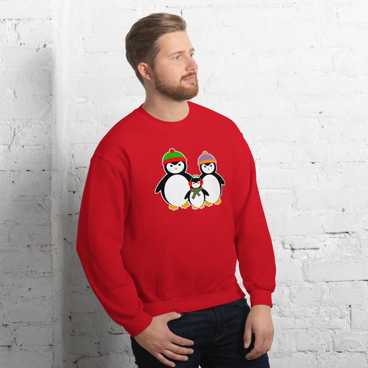 Red sweatshirt with penguin family graphic at center, crewneck long sleeves