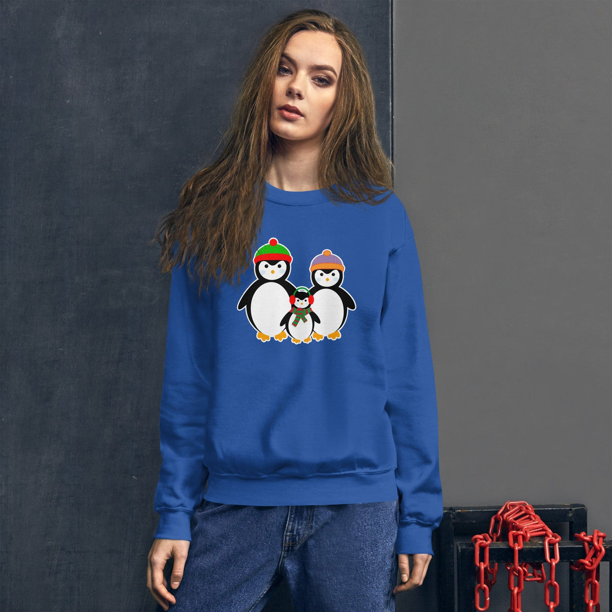 Blue sweatshirt with a penguin family graphic on the front chest.