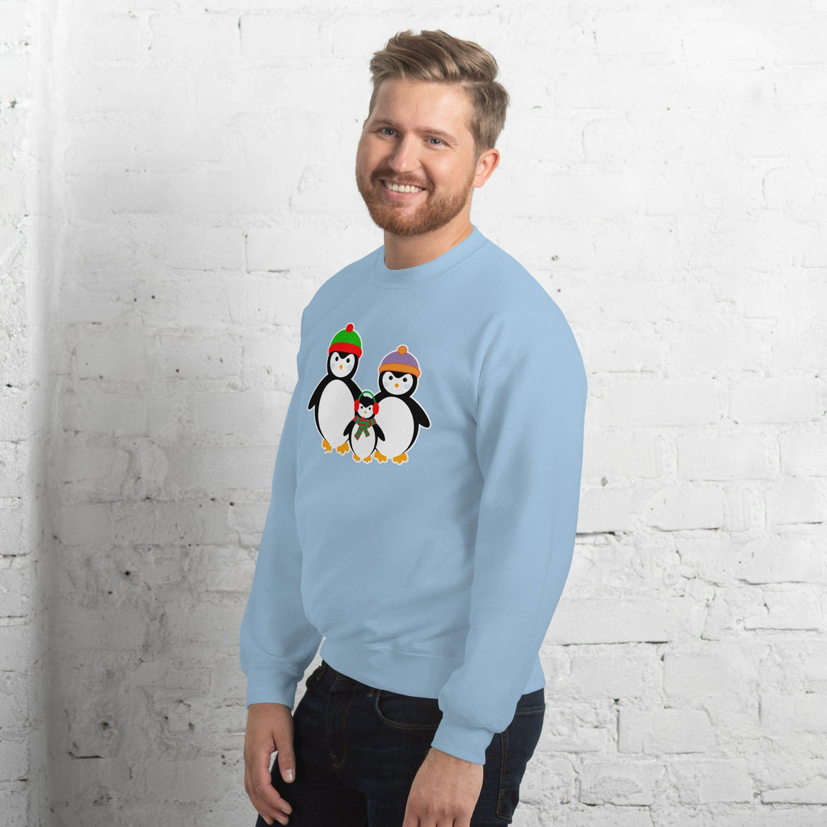 Light blue sweatshirt with penguin family graphic on front.
